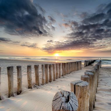 Wandbild - Sonnenuntergang am Strand und Meer